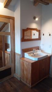 a bathroom with a sink and a mirror at Hotel Boutique Casa Werner in Puerto Varas