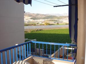 a balcony with a view of a green field at Apartamento Paraiso Sol in Torrox Costa
