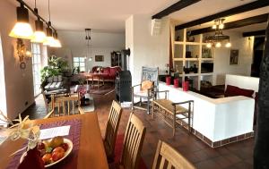 a living room with a table and chairs at Haus Birkenhof in Moorhausen