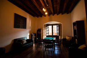 a living room with a table and chairs at Palacio Soran in Leintz-Gatzaga