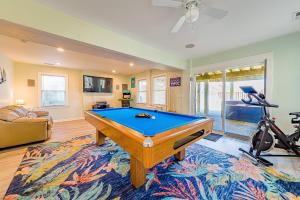 a living room with a pool table in it at Savannah - Nags Head MP 16, Oceanfront, Direct Beach Access, Pool, Hot Tub, Pool Table in Nags Head