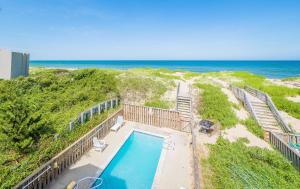 an overhead view of a swimming pool and the beach at Savannah - Nags Head MP 16, Oceanfront, Direct Beach Access, Pool, Hot Tub, Pool Table in Nags Head