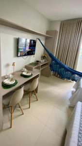 a living room with a table and two chairs at Dom Carlos in Belém