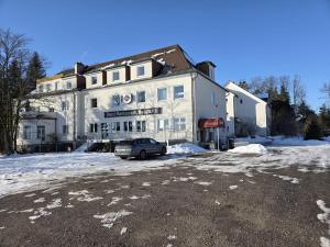 a building with a car parked in front of it at Hotel BURGWALD in Passau +16 photos