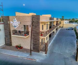 a building with a sign that reads banquet suites at Ancla Suites in Puerto Peñasco