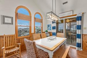 a dining room with a table and chairs at The Pickled Mermaid in Rodanthe