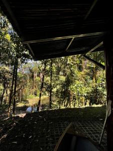 a view from the inside of a house with a forest at Cabaña kloski in Damita