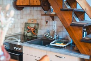 a kitchen with a sink and a stove at Kauperhaus in Burg