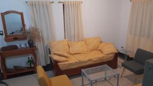 a living room with a couch and a table at Blend- Casa descanso Cafayate in Cafayate