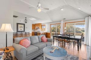 a living room with a couch and a table at The Sand Wedge in Kitty Hawk