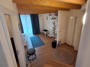 an overhead view of a living room with a table at Chalet La coccola di Lulù in Molina di Ledro +32 photos