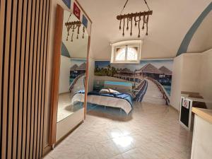 a bedroom with a mirror and a bed on a bridge at Dea in Maddaloni