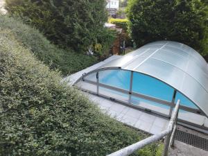 a dome house with glass windows on a sidewalk at "Ferienhaus-Ottendorf" mit Pool und Infarotkabine in Ottendorf