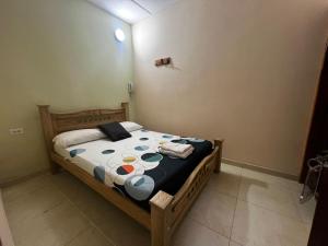 a bedroom with a bed in a room at Hotel Don Fermin in Barranquilla +17 photos