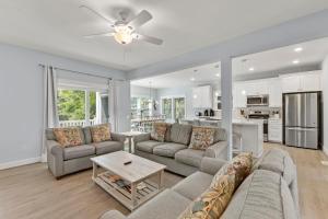 a living room with a couch and a table at Wax Turtle in Southern Shores