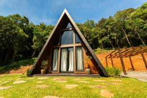 a small house with a pitched roof at Cabana Canto do Bugio in Gramado