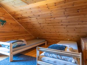 a log cabin with two bunk beds in it at Dream Forest Cabin -dom w lesie pod Warszawą in Warsaw