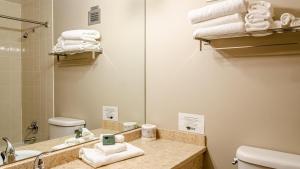 a bathroom with a sink and a mirror and towels at Cahilty #120 home in Sun Peaks