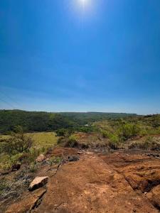 a view from the top of a hill with a blue sky at Fusca Home in Piedade