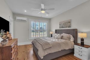 a bedroom with a bed and a ceiling fan at The Park House in Batesville