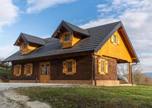 a house with a gambrel roof on top at Timber Home in Veliko Trgovišće