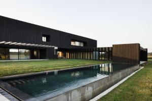 a house with a swimming pool in front of it at Casa Anjana in Rubayo