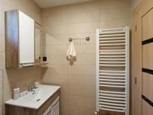 a bathroom with a sink and a mirror at Vila Sofija Mokra Gora in Mokra Gora +30 photos