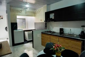 a kitchen with a sink and a counter top at Espacio Ideal 201 in Yopal +9 photos