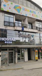 a building with a sign on the side of it at Hotel Diamante Azul in Huancayo