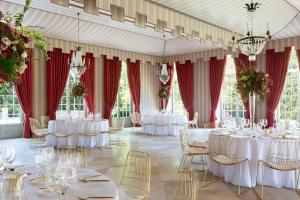 a banquet hall with white tables and chairs at Brenners Park Hotel & Spa, Oetker Hotels in Baden-Baden +160 photos