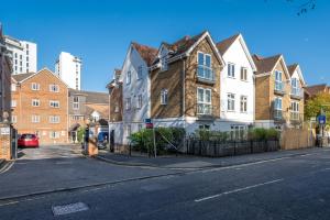 a row of houses on a city street at 2 Bed Flat in Woking Central in Woking
