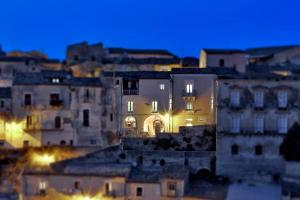a group of buildings in a city at night at Sabbinirica in Ragusa