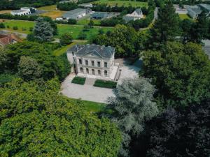 an aerial view of a large house with trees at Hôtel le Corbusson Laval Ouest in Saint-Berthevin-sur-Vicoin