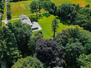an overhead view of a house in the middle of trees at Hôtel le Corbusson Laval Ouest in Saint-Berthevin-sur-Vicoin