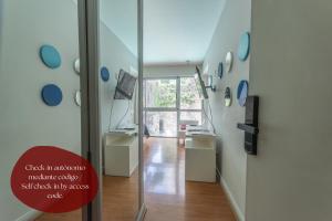 a room with a hallway with a glass door at Syrah Studios in Buenos Aires