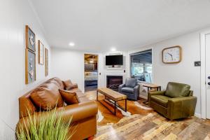 a living room with a couch and two chairs at Charming Mtn View Cabin Sleeps 8 Spacious Deck in Townsend