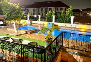 a view of a swimming pool from a balcony at 3R Haven in Kumasi
