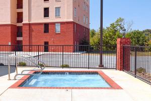 a small swimming pool in front of a building at River View Condo Sleeps 6 Shared Hot Tub & Pool in Pigeon Forge