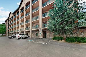 a parking lot in front of a large building at Downtown Summit Manor Sleeps 8 Mtn Views Pool in Gatlinburg