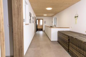 a hallway in a house with white walls at Huawa Appartements in Öblarn