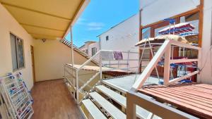 a balcony with a staircase in a house at Casa centro de Arica in Arica