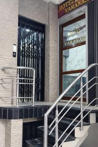 a building with a revolving door and stairs outside at Hotel In Varanasi in Varanasi
