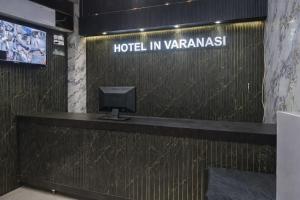 a hotel in varanasi with a sign on the wall at Hotel In Varanasi in Varanasi