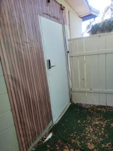 a door to a garage with a fence at Charming Private Studio,Full Amenities, Great Location in Orlando