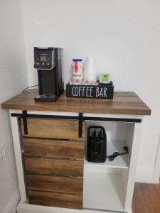 a coffee bar with a coffee maker on a table at Charming Private Studio,Full Amenities, Great Location in Orlando