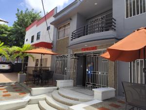 a building with bars on the front of it at Hotel Madeleine Norte in Barranquilla