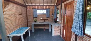 a small bathroom with a sink and a bench at Alam Kita in Karimunjawa