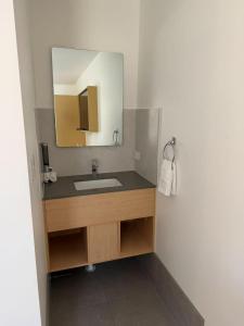 a bathroom with a sink and a mirror at Aspley Motor Inn in Brisbane +21 photos