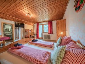 a bedroom with three beds in a room at Falkenstein in Krimml