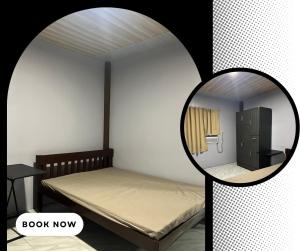 a small bedroom with a bed and a mirror at RobMar Haven in Sibulan